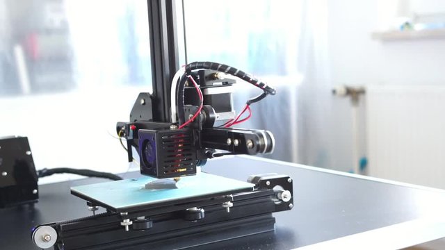 Small home 3D printer prints plastic toy  filament