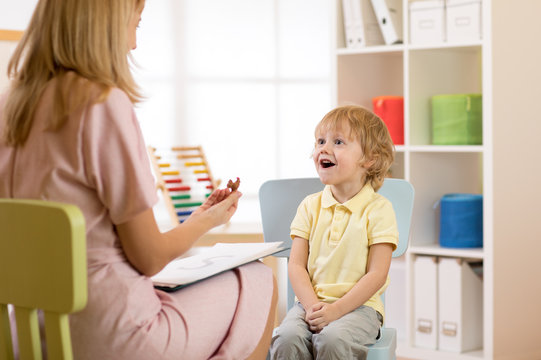 Psychologist working with child in office