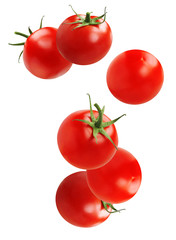 Falling tomato, isolated on white background.