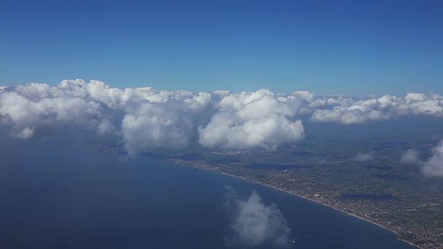 Flight over the Sea at the Level of Clouds