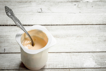 Fruit yogurt with spoons.