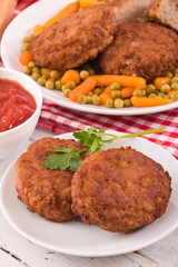 Meatballs on white dish.