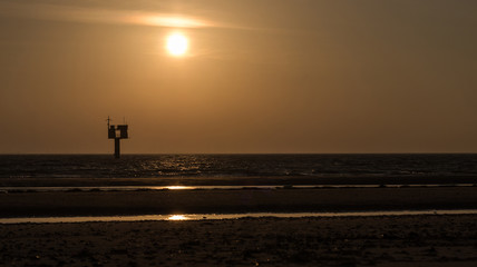 In the evening sun on a deserted beach