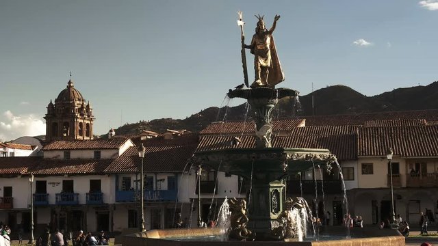 afternoon shot of the fountain and statue of pachacuti in plaza de armas, cusco
