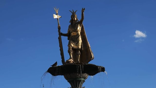 close up of the statue of pachacuti on top of the fountain in cusco, peru