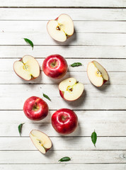 Fresh red apples with leaves.