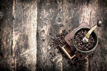 Coffee grinder with coffee beans.