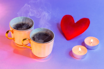 two vintage coffee cups and red handmade hart figure on purple b, smoke, steam