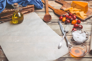 Food composition with copy space on a wooden background. Mediterranean traditional cuisine. Easy vintage toning
