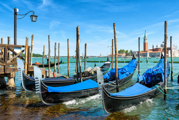 Fototapeta na wymiar Berth with gondolas at San Marco, Venice, Italy