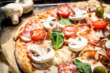 Fresh pizza with mushrooms.