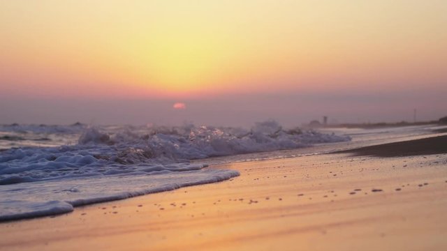 Waves at the beach in the evening in slow motion. 3840x2160