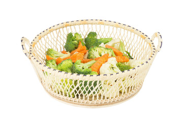 Fototapeta na wymiar cauliflower. carrot. broccoli. slice. in basket wooden. isolated on white background