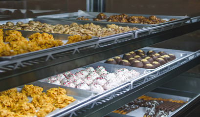 Candy shop gourmet chocolates clusters and brittle bars.