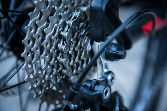 Closeup of a bicycle gears mechanism and chain on the rear wheel of mountain bike.