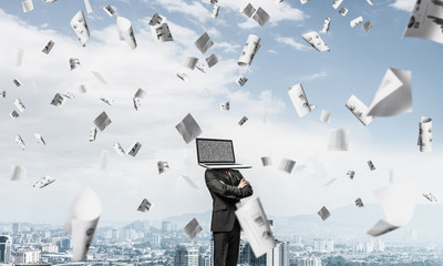 Businessman with laptop instead of head.