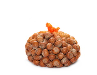 hazelnuts in bag isolated white background