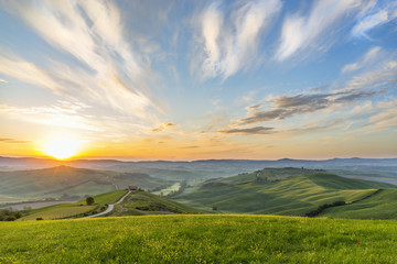 Sunrise on a meadow in a rural Italian landscape