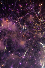 Stunning bright vibrant and colorful fireworks in the night sky during new year celebrations