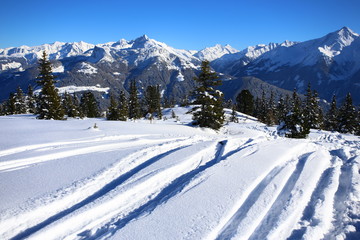 Wintery mountain landscape with sunshine