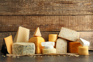 Different kinds of delicious cheese on table - Powered by Adobe