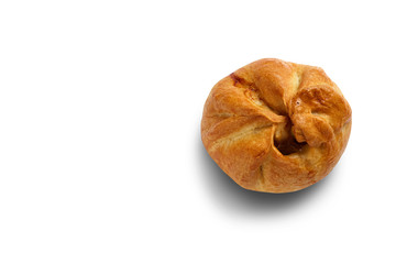 Baked bun on a white background close-up. Isolate.