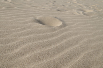 Sunny golden sand in a beautiful day