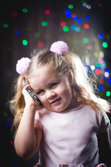 Girl with red hair on the phone wearing her Christmas dress