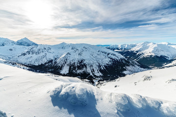 Fototapeta premium In the morning tourists walk in snow-covered Kasprowy Wierch