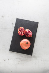 Pomegranate. Pieces of frest pomegranate on plate