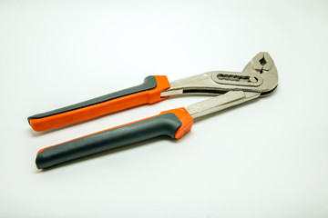 Adjustable plumbing and pipe wrench pincers. Isolated photo