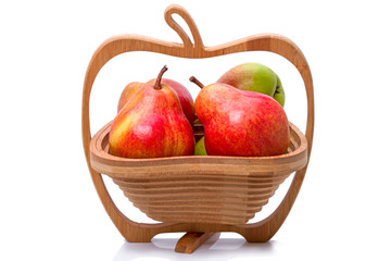 Ripe pears in a wooden vase