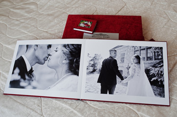 Pages of red wedding photobook or wedding album on white background.