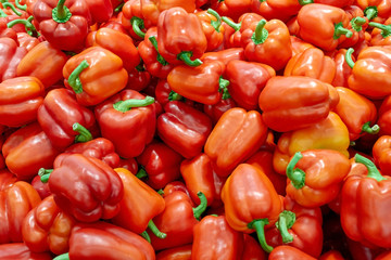 Obraz na płótnie Canvas Fresh red peppers on the market, natural paprika