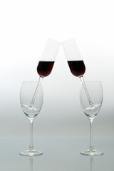 glasses with red wine on a light background