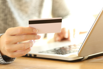 Close up of a girl hand using a credit card