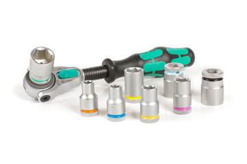 Socket wrench with various bits on the white background