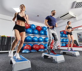 Fitness trainer with women doing cardio