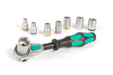 Socket wrench with various bits on the white background