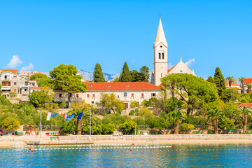 Old church in Sumartin port on sunny summer day, Brac island, Croatia