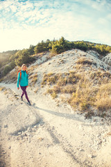 A girl with a backpack.