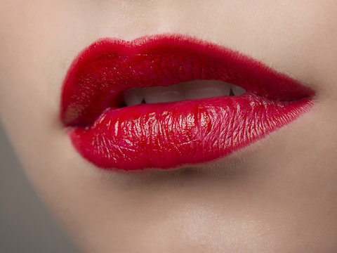 Lips in red lipstick close-up macro