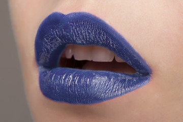Lips with blue lipstick close-up