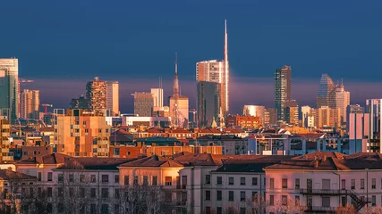 Türaufkleber Cityscape of Milan kissed by a gold light at the sunset © Alberto Ialongo 