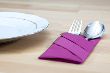 Cutlery with purple napkin