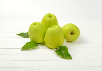 Four green apples