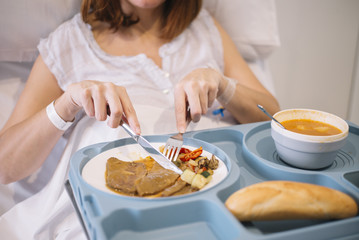 woman eating in the hospital