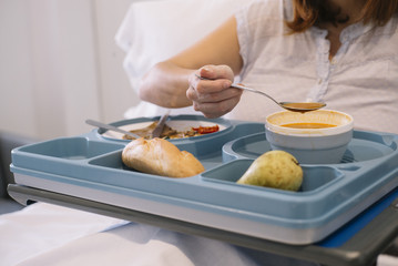 woman eating in the hospital