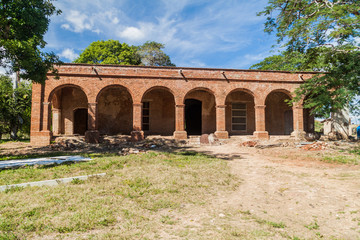Fototapeta na wymiar Main building of sugar mill San Isidro de los Destiladeros in Valle de los Ingenios valley near Trinidad, Cuba