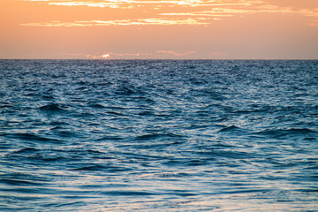 Sunset at a rough sea